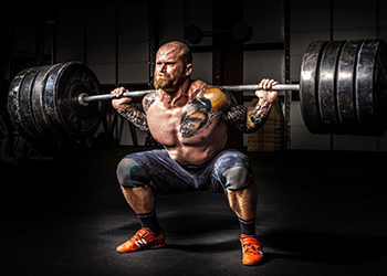 man squatting to lose weight