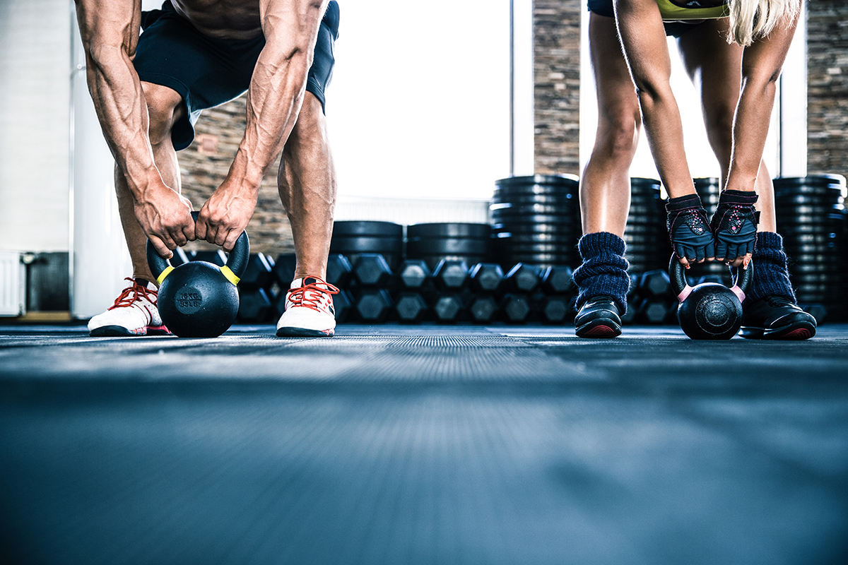 man and woman working out loose skin after losing weight