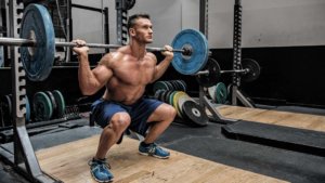 man doing squats at home workouts for men