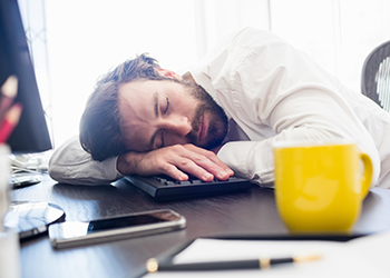 man sleeping at his desk weight loss workout plan