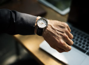 man checking watch total body workout