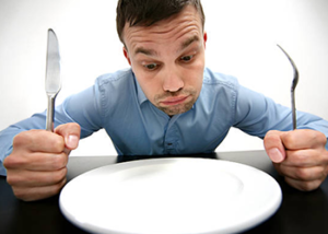 man looking at empty plate intermittent fasting basics