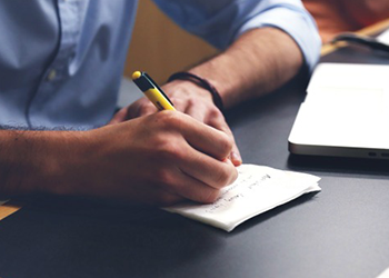 man writing how much muscle can I gain in a week