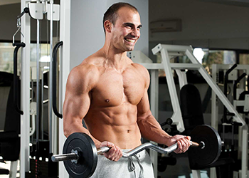 man doing curls total body workout