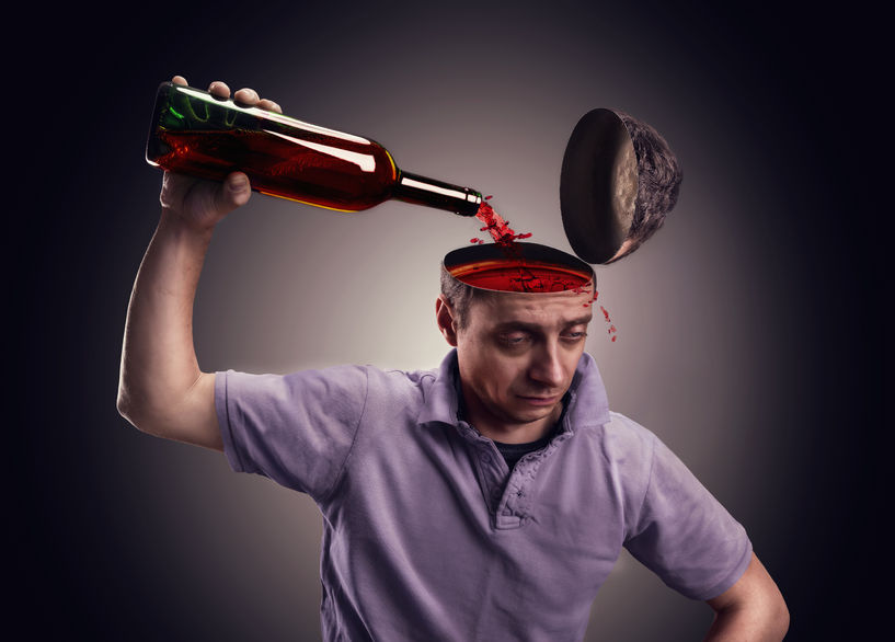 38531668-man-pours-his-head-on-with-alcohol-over-gray-the-fit