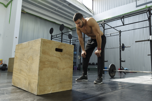 man preparing to jump on box power workout for men