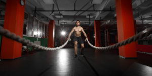 man using battle ropes healthy lifestyle improves mental clarity
