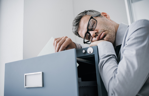 man sleeping at work hydration and weight loss